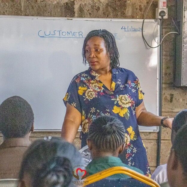 Lydia Opiyo, the founder of Passion to Share Foundation, during a session with students /PHOTO BY PASSION TO SHARE FOUNDATION